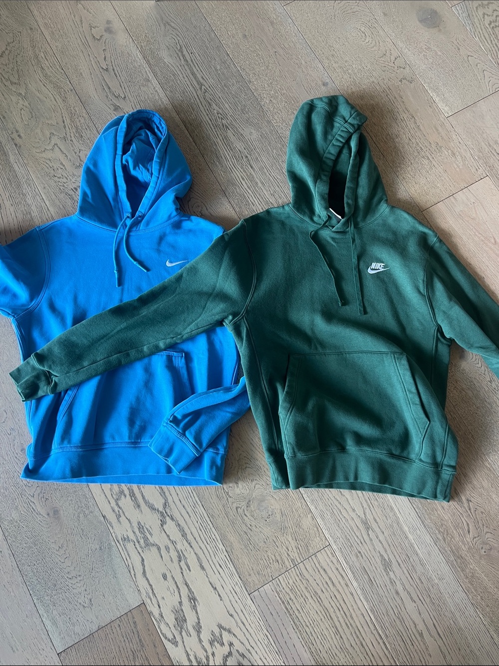 2 Nike Hoodies - one Blue one Dark Green. Men’s small. Both in great condition.